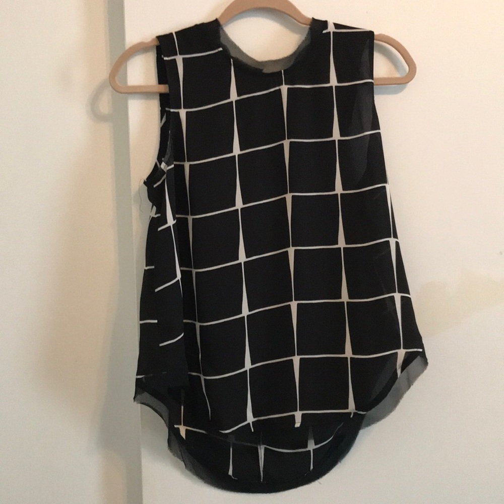 Black and white sleeveless blouse